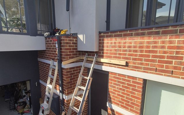 Repair works on a two-storey brick home